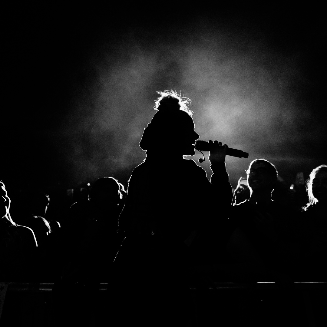 Monochrome Photo of Person Singing