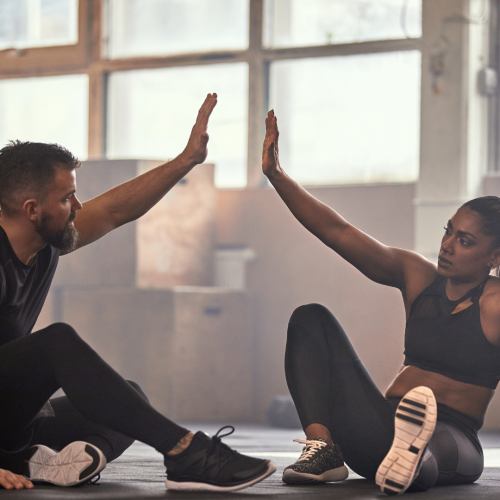 Work out partners high-five in Bowe, MD.